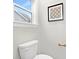 Small bathroom with toilet and window at 13026 Arnold Palmer Cir # 1051, Lancaster, SC 29720