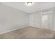 Bedroom with carpet and hallway view at 13026 Arnold Palmer Cir # 1051, Lancaster, SC 29720