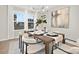 Elegant dining room featuring a wood table, neutral chairs, and modern art at 13026 Arnold Palmer Cir # 1051, Lancaster, SC 29720