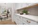 White kitchen cabinets and quartz countertops with a butler's pantry at 13026 Arnold Palmer Cir # 1051, Lancaster, SC 29720