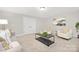 Spacious living room with two armchairs and a coffee table at 13026 Arnold Palmer Cir # 1051, Lancaster, SC 29720
