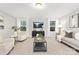 Bright living room with comfy seating and large TV at 13026 Arnold Palmer Cir # 1051, Lancaster, SC 29720