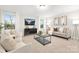 Open living room with seating area and large windows at 13026 Arnold Palmer Cir # 1051, Lancaster, SC 29720