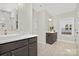 Main bathroom features a double vanity, large mirror, and a window at 13026 Arnold Palmer Cir # 1051, Lancaster, SC 29720