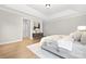Main bedroom with hardwood floors and access to bathroom and hallway at 13026 Arnold Palmer Cir # 1051, Lancaster, SC 29720