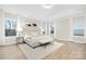 Spacious main bedroom with hardwood floors, large windows, and a cozy sitting area at 13026 Arnold Palmer Cir # 1051, Lancaster, SC 29720