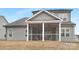 Screened porch with ceiling fans and furniture at 13026 Arnold Palmer Cir # 1051, Lancaster, SC 29720