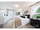 Bright bedroom featuring neutral decor, plush carpeting, and ample natural light from large windows at 3035 Howell Mill Rd # 51, Charlotte, NC 28208