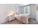 Comfortable bedroom featuring soft lighting, neutral bedding, and a serene atmosphere at 3035 Howell Mill Rd # 51, Charlotte, NC 28208