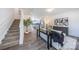 Open concept living room showcasing modern decor and stairs leading to the upper level at 3035 Howell Mill Rd # 51, Charlotte, NC 28208