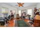 Home office with built-in shelving, hardwood floors, and ample natural light at 41166 Calla Lily St, Fort Mill, SC 29707