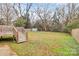 Large backyard with wooden deck, shed, and fenced area at 5442 Kinsale Ln, Charlotte, NC 28215