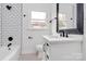 Clean bathroom with white vanity and black accents at 5442 Kinsale Ln, Charlotte, NC 28215