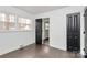 Bright bedroom with dark hardwood floors and ample closet space at 5442 Kinsale Ln, Charlotte, NC 28215