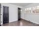 Spacious bedroom with dark hardwood floors and lots of natural light at 5442 Kinsale Ln, Charlotte, NC 28215