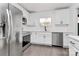 Modern kitchen with stainless steel appliances and white cabinets at 5442 Kinsale Ln, Charlotte, NC 28215