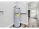 Laundry room with new water heater and vinyl flooring at 5442 Kinsale Ln, Charlotte, NC 28215