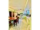 Bright kitchen with white appliances and wood dining table at 6219 Long Pine Dr # 32, Charlotte, NC 28227