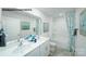 Bathroom with double vanity, shower/tub combo, and teal accents at 1063 Horizon Ln, Chester, SC 29706