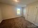 Simple bedroom with neutral walls and carpeted floors at 1063 Horizon Ln, Chester, SC 29706