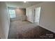 Bright bonus room featuring a window, carpet, and multiple doors at 1063 Horizon Ln, Chester, SC 29706