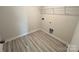 Laundry room with vinyl flooring and overhead shelving at 1063 Horizon Ln, Chester, SC 29706