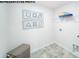 Bright laundry room with wire shelving and tile flooring at 1063 Horizon Ln, Chester, SC 29706