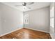 Light and airy bedroom featuring hardwood floors and a ceiling fan at 1076 Fox Chase Dr, Newton, NC 28658