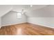 Large bedroom with hardwood floors, window, and ceiling fan at 1076 Fox Chase Dr, Newton, NC 28658