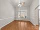 Hardwood floor dining room with large window and ceiling fan at 1076 Fox Chase Dr, Newton, NC 28658