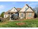 Brick and stone two-story house with landscaped lawn at 1076 Fox Chase Dr, Newton, NC 28658