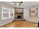 Stone fireplace in breakfast nook with hardwood floors at 1076 Fox Chase Dr, Newton, NC 28658