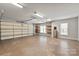 Spacious garage with overhead door and shelving for storage at 1076 Fox Chase Dr, Newton, NC 28658