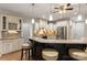 Kitchen features an island with seating and upgraded cabinetry at 1076 Fox Chase Dr, Newton, NC 28658