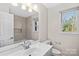 Clean bathroom with updated vanity and a large window at 1103 Hulston Ct, Charlotte, NC 28211