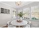 Bright breakfast nook with a white table and built-in window seat at 1103 Hulston Ct, Charlotte, NC 28211