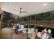 Covered deck features a ceiling fan and comfortable seating area at 1103 Hulston Ct, Charlotte, NC 28211