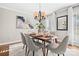 Modern dining room with six chairs, a wood table, and a chandelier at 1103 Hulston Ct, Charlotte, NC 28211