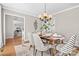 Bright dining area with hardwood floors and view into adjacent room at 1103 Hulston Ct, Charlotte, NC 28211