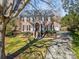 Brick house with two-car garage and landscaped yard at 1103 Hulston Ct, Charlotte, NC 28211