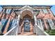 Front entrance with black door, white railings, and brick facade at 1103 Hulston Ct, Charlotte, NC 28211