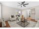 Light-filled living room featuring hardwood floors and a cozy sitting area at 1103 Hulston Ct, Charlotte, NC 28211