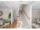 Elegant staircase with carpeted steps and wooden handrail at 1103 Hulston Ct, Charlotte, NC 28211