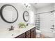 Bathroom with double vanity and a tub shower combo at 1209 Cedar Park Dr, Pineville, NC 28134