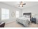 Bedroom features carpet, a ceiling fan, and a decorative headboard at 1209 Cedar Park Dr, Pineville, NC 28134