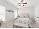 Cozy bedroom featuring carpet, a ceiling fan, and a decorative headboard at 1209 Cedar Park Dr, Pineville, NC 28134