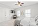 Bedroom includes carpet, ceiling fan, and natural light with a decorative headboard at 1209 Cedar Park Dr, Pineville, NC 28134