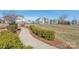 Curved community path with manicured landscaping and benches at 1209 Cedar Park Dr, Pineville, NC 28134