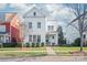 Charming two-story white home with a well-maintained lawn, landscaping, and inviting curb appeal at 1209 Cedar Park Dr, Pineville, NC 28134