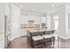 Spacious kitchen featuring white cabinets, a center island with seating, and stainless appliances at 1209 Cedar Park Dr, Pineville, NC 28134